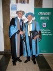 Colin Squire (right) receiving his honorary degree from Ron Tuninga (left).